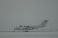 N791DC @ KBIL - DBC Beech King Air B200 on a snowy day @ Billings Logan - by Daniel Ihde