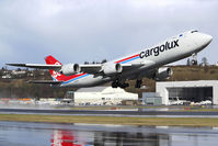 N5573S @ KBFI - Seen departing a soaked BFI is this 747-8R7F for Cargolux. - by Joe G. Walker