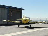 N723CT @ CCB - All yellow and checkered parked at hanger - by Helicopterfriend