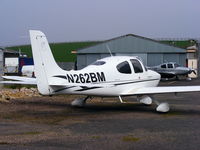 N262BM @ EGBJ - privately owned Cirrus normally based at Weston, Ireland - by Chris Hall