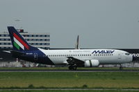HA-LEX @ EHAM - Malev Boeing 737-300 landing at Schiphol airport. - by Henk van Capelle