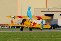 G-CGPY @ EGNR - promoting the new animated film 'Rio' taking 'Blu' wingwalking - by Chris Hall