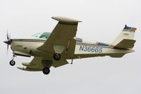 N36665 @ EGGP - on short finals for RW27 - by Chris Hall