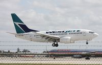 C-GWSJ @ MIA - West Jet 737-600 - by Florida Metal