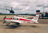 OY-DRI @ EHLE - Danish Aero Club. Background R44 , OY-HLI - by Henk Geerlings