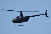 PH-WPW @ EHAM - R44 over the Panorama terrace - by Chris Hall