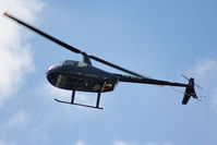 PH-WPW @ EHAM - R44 over the Panorama terrace - by Chris Hall
