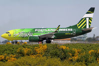 N607AS @ KSEA - AS 737-790 seen in the colors of the PORTLAND TIMBERS soccer team. Design is the result of the combination of two winning entries. - by Joe G. Walker