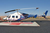 N220LN @ 67L - 1987 Bell 222U, c/n: 47567 of Mercy Air at Mesquite , NV - by Terry Fletcher