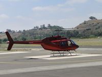 N1404W @ POC - Parked at the westside helipad parking area - by Helicopterfriend