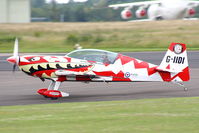 G-IIDI @ EGBP - Power Aerobatics Ltd Extra landing after its display at the Cotswold Airshow - by Chris Hall