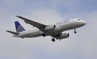 N424UA @ KLAX - Landing at LAX - by Todd Royer