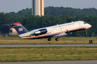 N455AW @ ORF - US Airways Express (Air Wisconsin) N455AW (FLT AWI3635) departing RWY 23 en route to New York La Guardia (KLGA). - by Dean Heald