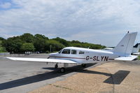 G-SLYN @ EGHH - Taken from the Flying Club - by planemad