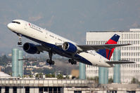 N751AT @ LAX - Delta Air Lines N751AT (FLT DAL1299) climbing out from RWY 25R en route to Kona Int'l (KOA/PHKO).  It's hard to believe that this airplane is over 26 years old at the time of this photo. - by Dean Heald