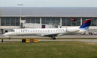 N576RP @ KDTW - A Delta Connection ERJ taxies past the DTW international terminal. - by Daniel L. Berek