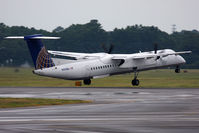 N199WQ @ ORF - Continental Connection (Colgan Air) N199WQ departing RWY 23 en route to Newark Int'l (KEWR) in rainy conditions with condensation seen corkscrewing from the propeller tips. - by Dean Heald