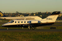 VH-MGC @ YSSY - early departure...taxi to 34 R - by Bill Mallinson