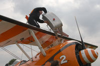 N74189 @ X5FB - Pilot David Barrell re-assembles the long range tank prior to the return journey South following a wing walking appearance at the Sunderland Airshow; Fishburn Airfield, July 2011. - by Malcolm Clarke