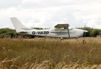 G-WARP @ EGFH - Visiting Cessna Skylane taxying prior to departure. - by Roger Winser