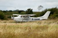 G-WARP @ EGFH - Visiting Cessna Skylane departing Runway 22. - by Roger Winser