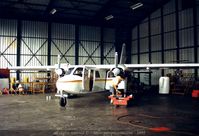 F-OCOY @ NTAA - Circa 1997 with Air Moorea in the maintenance hangar. - by Garey T. Martin