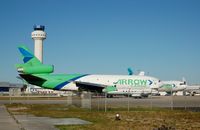 N450ML @ OPF - Miami Leasing Inc., McDonnell Douglas DC-10-30F No. N450ML and the Control Tower at Opa Locka Airport, Opa Locka, FL - by scotch-canadian