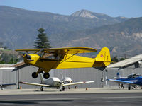 N4C @ SZP - 1947 Piper J3C-65 CUB, Continental A&C65 65 Hp, landing Rwy 22. 6,704' Hines Peak in background - by Doug Robertson