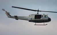 N416NA - NASA UH-1B flying along Indian River at Titusville - by Florida Metal