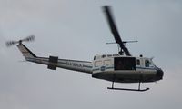 N416NA - NASA UH-1B flying over Indian River near Titusville - by Florida Metal