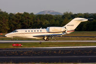 N989QS @ PDK - NetJets N989QS rolling out on RWY 2R after arrival from Tampa Int'l (KTPA). Stone Mountain can be seen in the background. - by Dean Heald