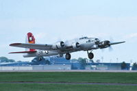 N5017N @ KOSH - Departing for the bomber flight - by Glenn E. Chatfield