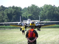 N41759 @ D52 - Being followed after landing at the 2011 Geneseo Air Show. A beautiful day for flying. - by Terry L. Swann