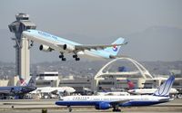 HL7552 @ KLAX - Departing LAX - by Todd Royer