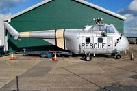 XN380 @ EGMH - Westland Whirlwind HAS.7 being painted to look like a USAF Sikorsky H-19 Chickasaw rescue helicopter. At the History of RAF Manston museum. - by moxy