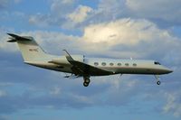 N57EL @ KSAT - Landing 12R, 1st shot of Enterprises new G450 - by RWB