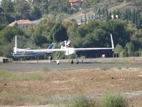 N606TT @ POC - Departing Transient parking on taxiway Sierra headed to runway 26 - by Helicopterfriend