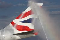 G-BNLU @ MCO - British Airways Dreamflight water cannon salute - by Florida Metal