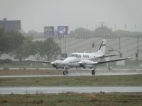 N905TF @ POC - Heading west on runway 26L in the rain - by Helicopterfriend