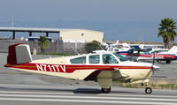 N711TV @ KSQL - Locally-based 1965 Beech S35 Bonanza running-up engine at San Carlos, CA - by Steve Nation