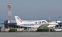 N4334V @ KSQL - Bel-Air 1984 Piper PA-28-181 on training flight final approach @ San Carlos, CA - by Steve Nation