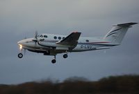 G-LIVY @ EGFH - Dusk departure of Dragonfly Aviation Service's Super King Air. - by Roger Winser