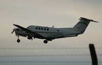 G-KVIP @ EGFH - Dusk departure of Capital Air Charter's Super King Air - by Roger Winser