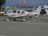 N63EK @ KSQL - Big George Aviation (Stateline, NV) 2004 Cirrus Design SR22 with flying trombone logo on tail (port side only) at San Carlos, CA - by Steve Nation