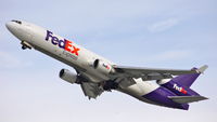 N592FE @ KLAX - FedEx MD-11F departing 25L - by speedbrds