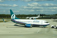 N330AT @ RSW - Pushing an AirTran at RSW (and a piggybacking Spirit) - by Mauricio Morro