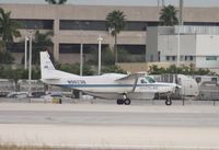 N9623B @ MIA - Cessna 208B departing on Runway 8L