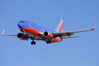 N207WN @ LAS - Southwest Airlines N207WN (FLT SWA358) from Denver Intl (KDEN) on short final RWY 25R. - by Dean Heald