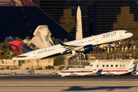 N703TW @ LAS - Delta Air Lines N703TW (FLT DAL128) departing RWY 1R en route to John F Kennedy Int'l (KJFK). - by Dean Heald