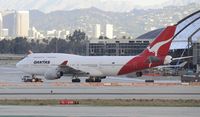 VH-OJT @ KLAX - Getting towed away from the gate - by Todd Royer
